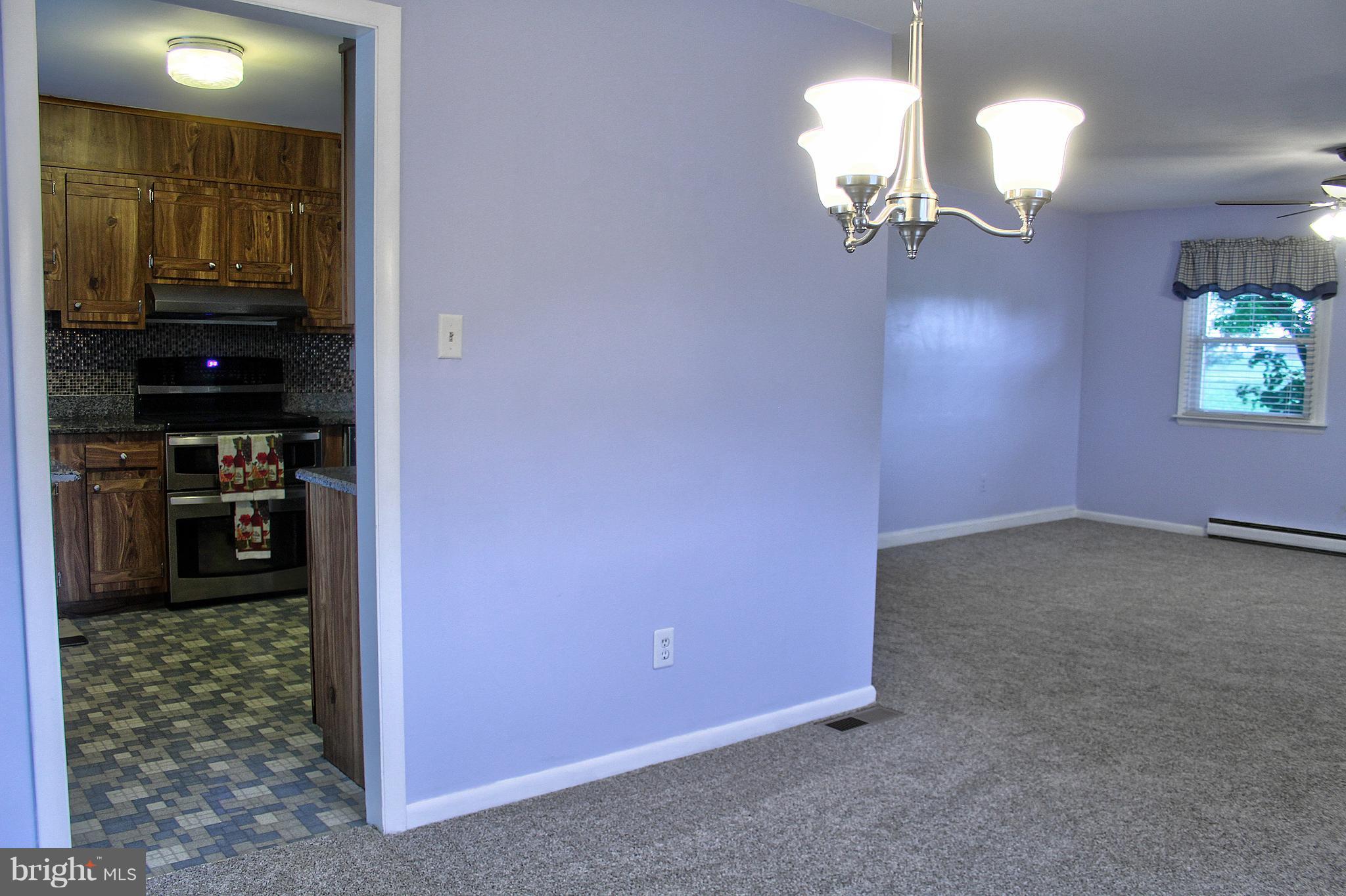 2409 Gillis Road Mount Airy, MD 21771 - Photo 9 of 27 a view of a chandelier in a room