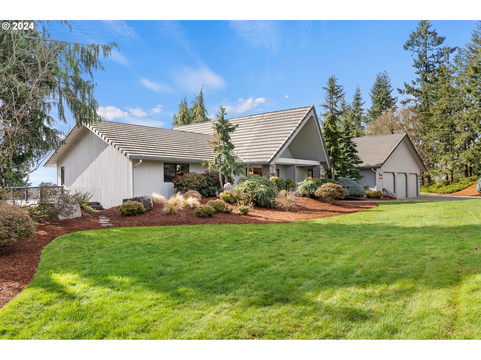 20200 Northwest 18th Place Ridgefield, WA 98642 - Photo 8 of 48 a view of a house with backyard and sitting area