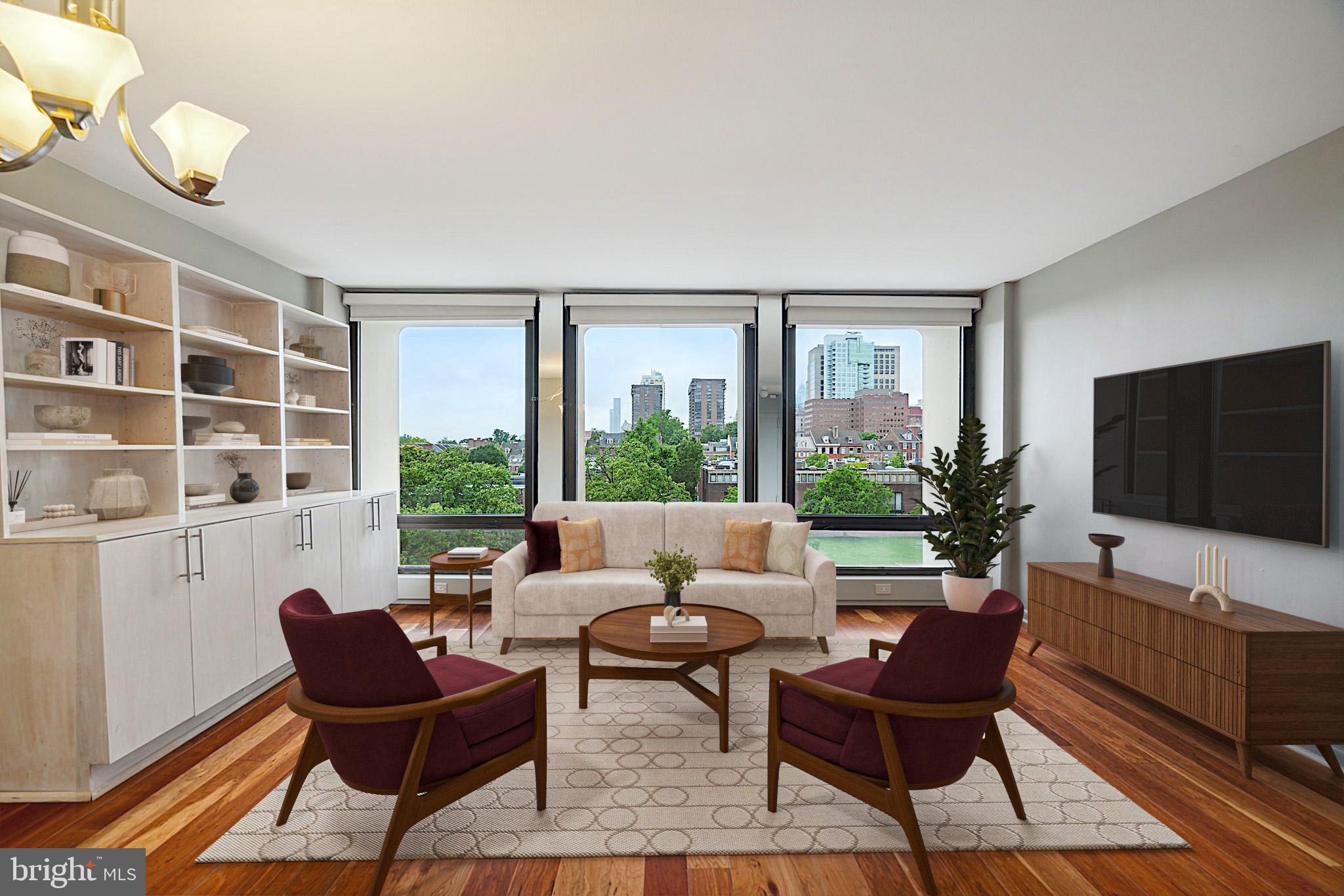 220 Locust Street, Unit 3H Philadelphia, PA 19106 - Photo 4 of 29 a living room with furniture and a flat screen tv