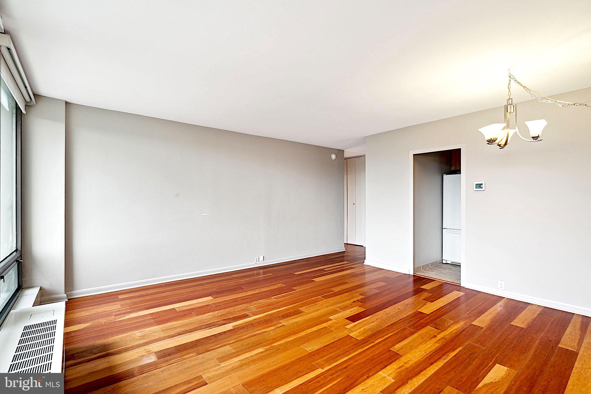 220 Locust Street, Unit 3H Philadelphia, PA 19106 - Photo 8 of 29 a view of empty room with wooden floor and fan