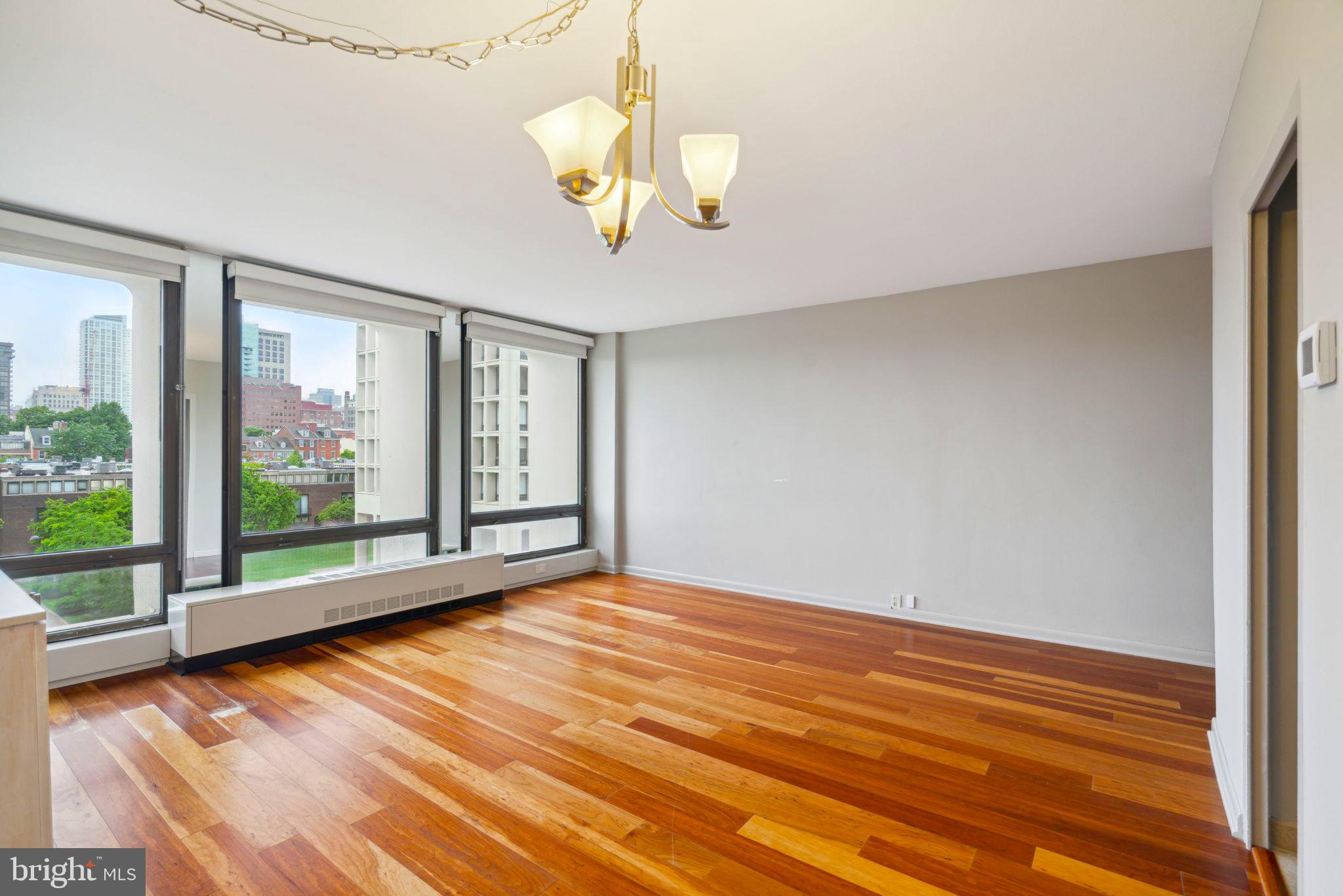 220 Locust Street, Unit 3H Philadelphia, PA 19106 - Photo 10 of 29 a view of empty room with wooden floor and fan