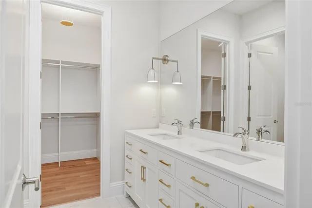 a bathroom with a sink double vanity and a mirror
