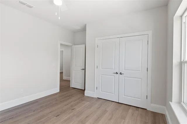 an empty room with wooden floor