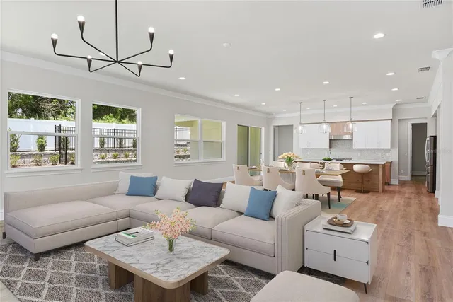 a living room with furniture and a table