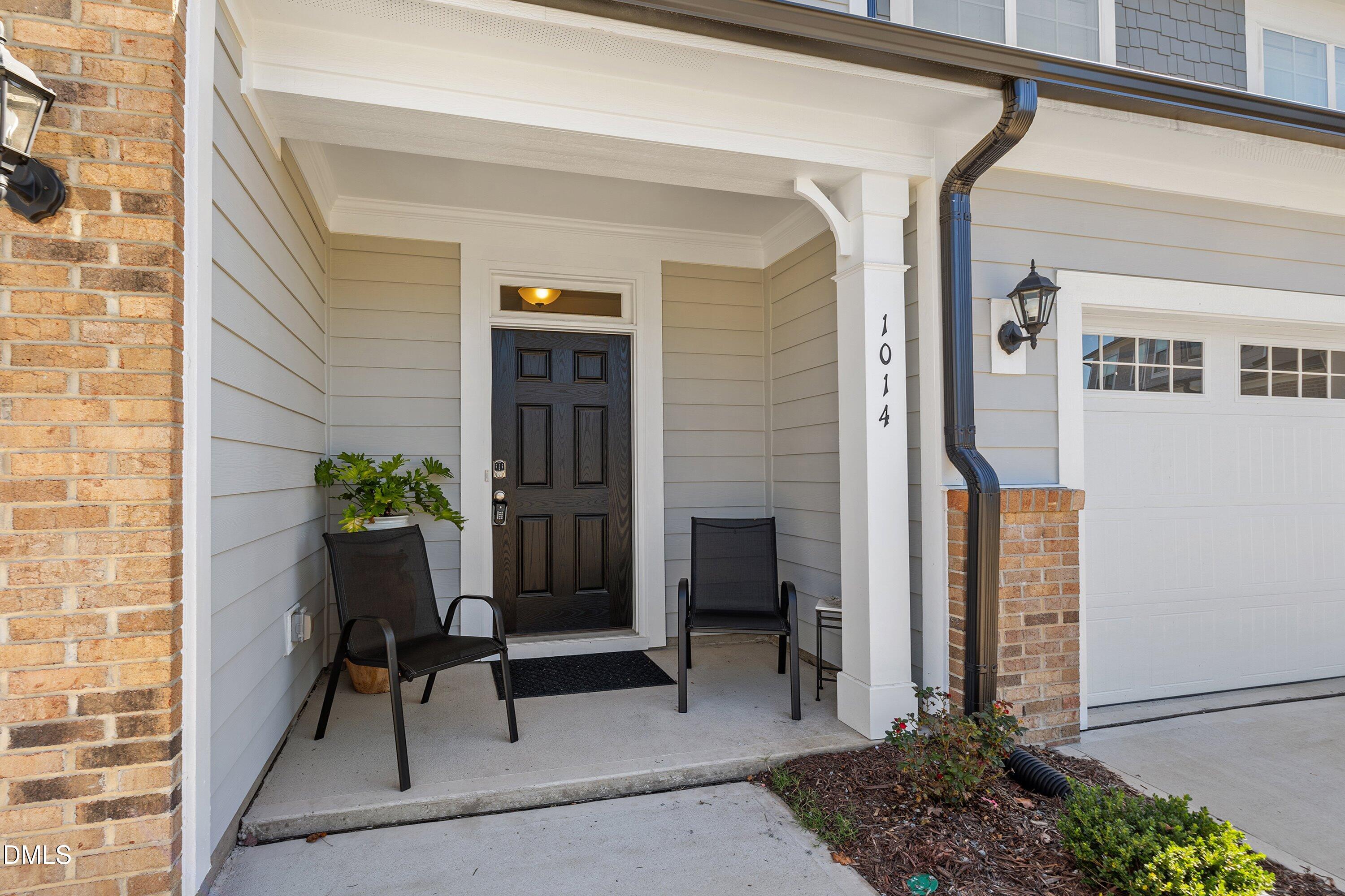 1014 Culloden Circle Durham, NC 27713 - Photo 2 of 32 a balcony with furniture and a potted plant