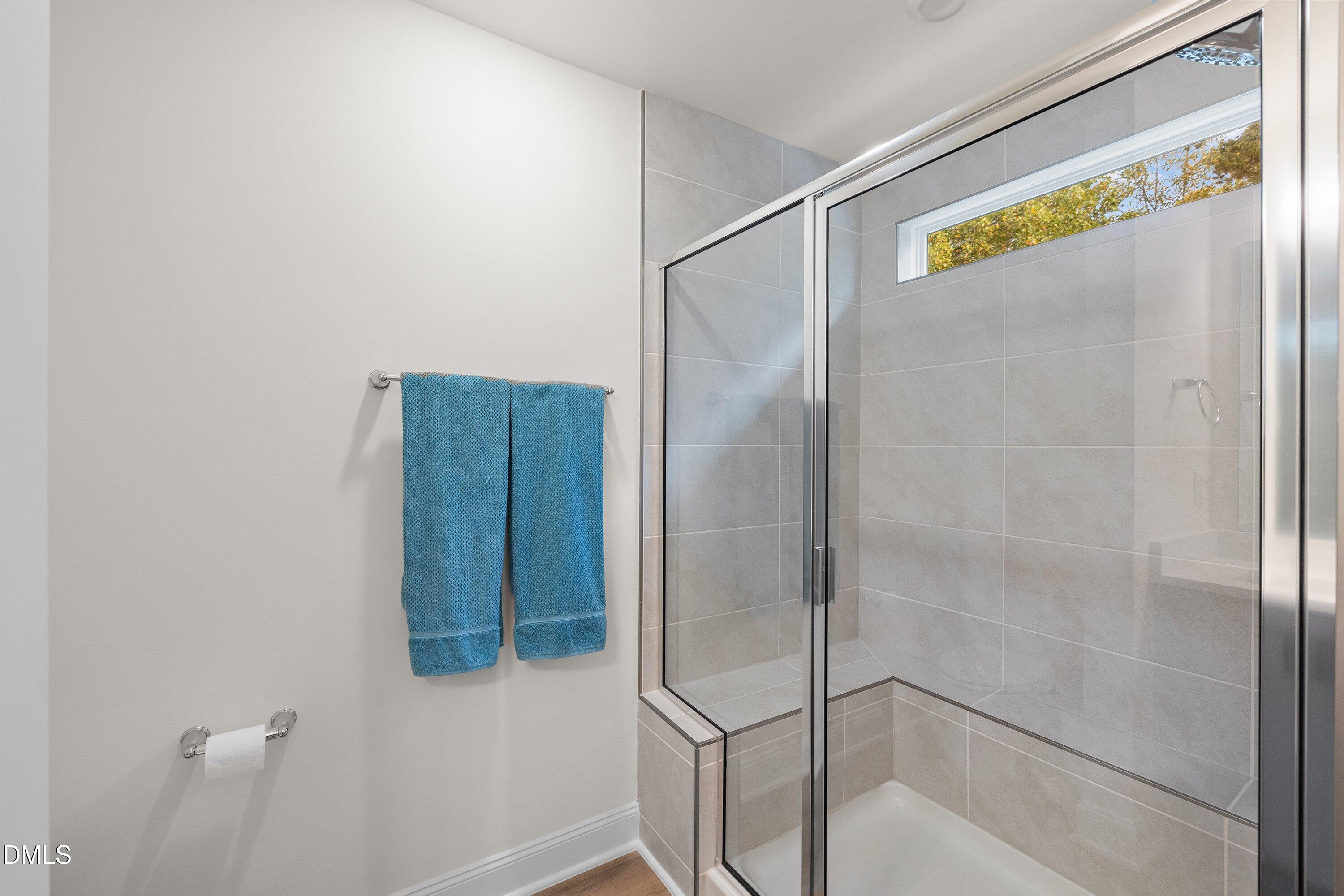 1014 Culloden Circle Durham, NC 27713 - Photo 21 of 32 a bathroom with a glass shower door