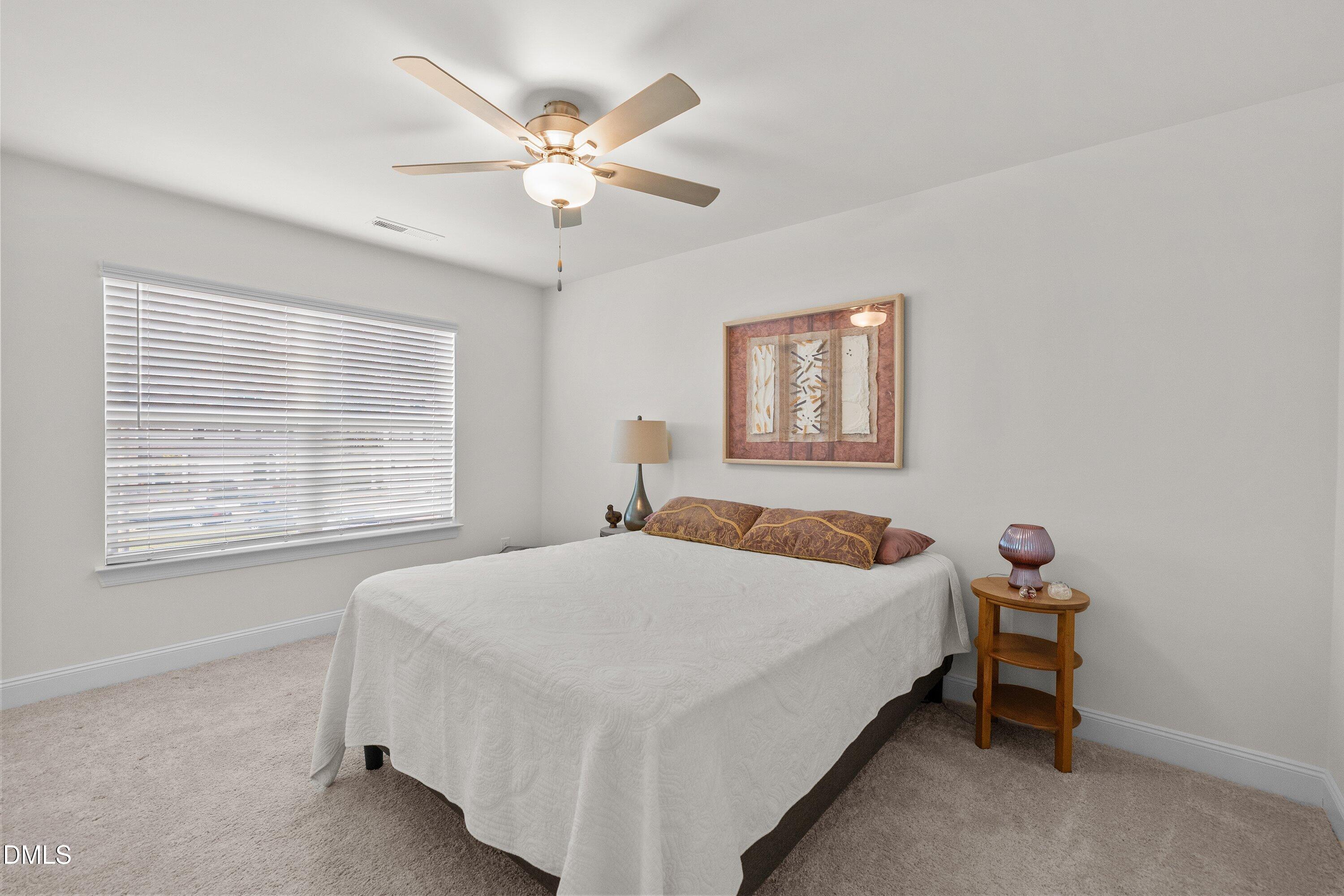 1014 Culloden Circle Durham, NC 27713 - Photo 22 of 32 a bedroom with a bed and a window