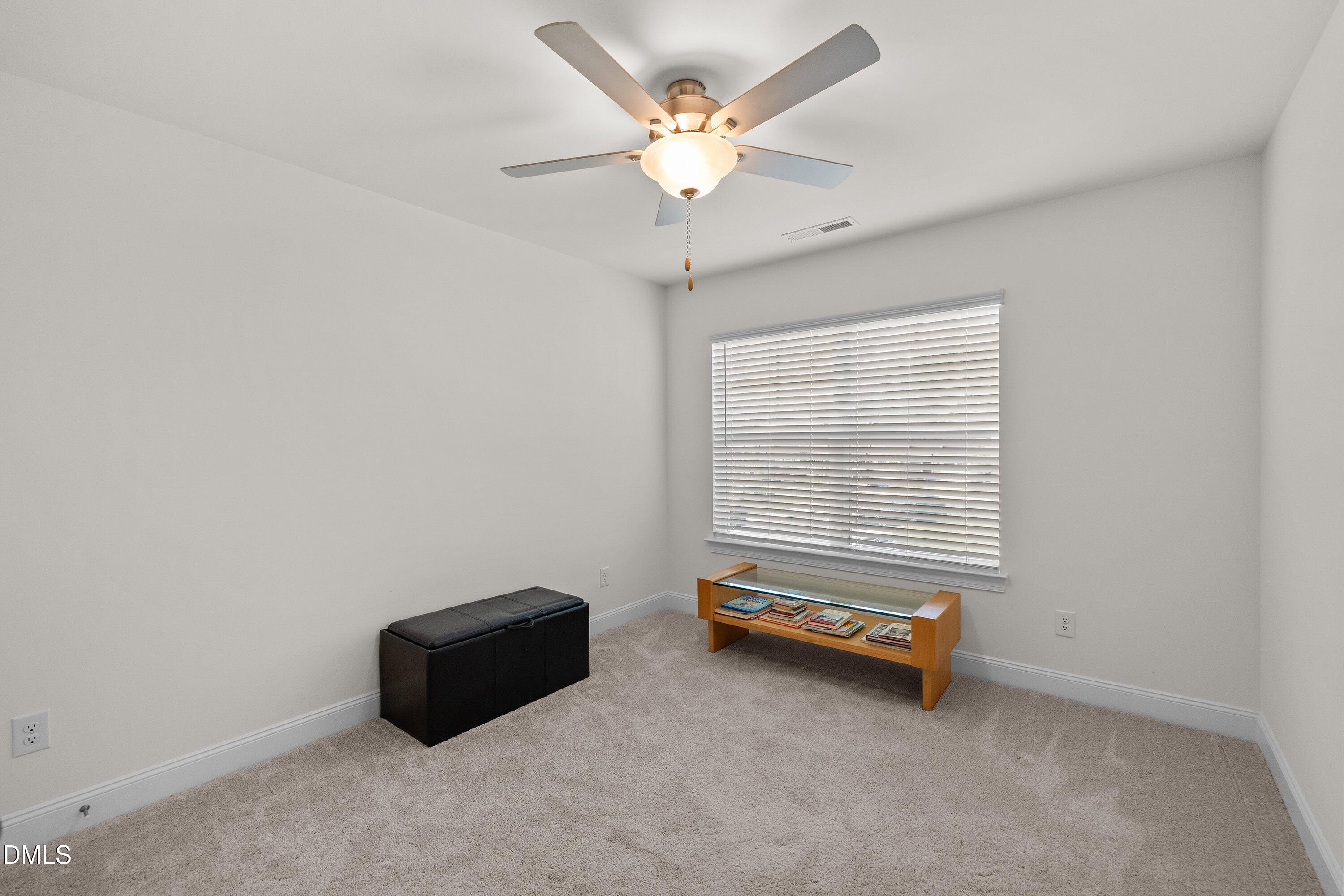 1014 Culloden Circle Durham, NC 27713 - Photo 24 of 32 a room with a window and a ceiling fan
