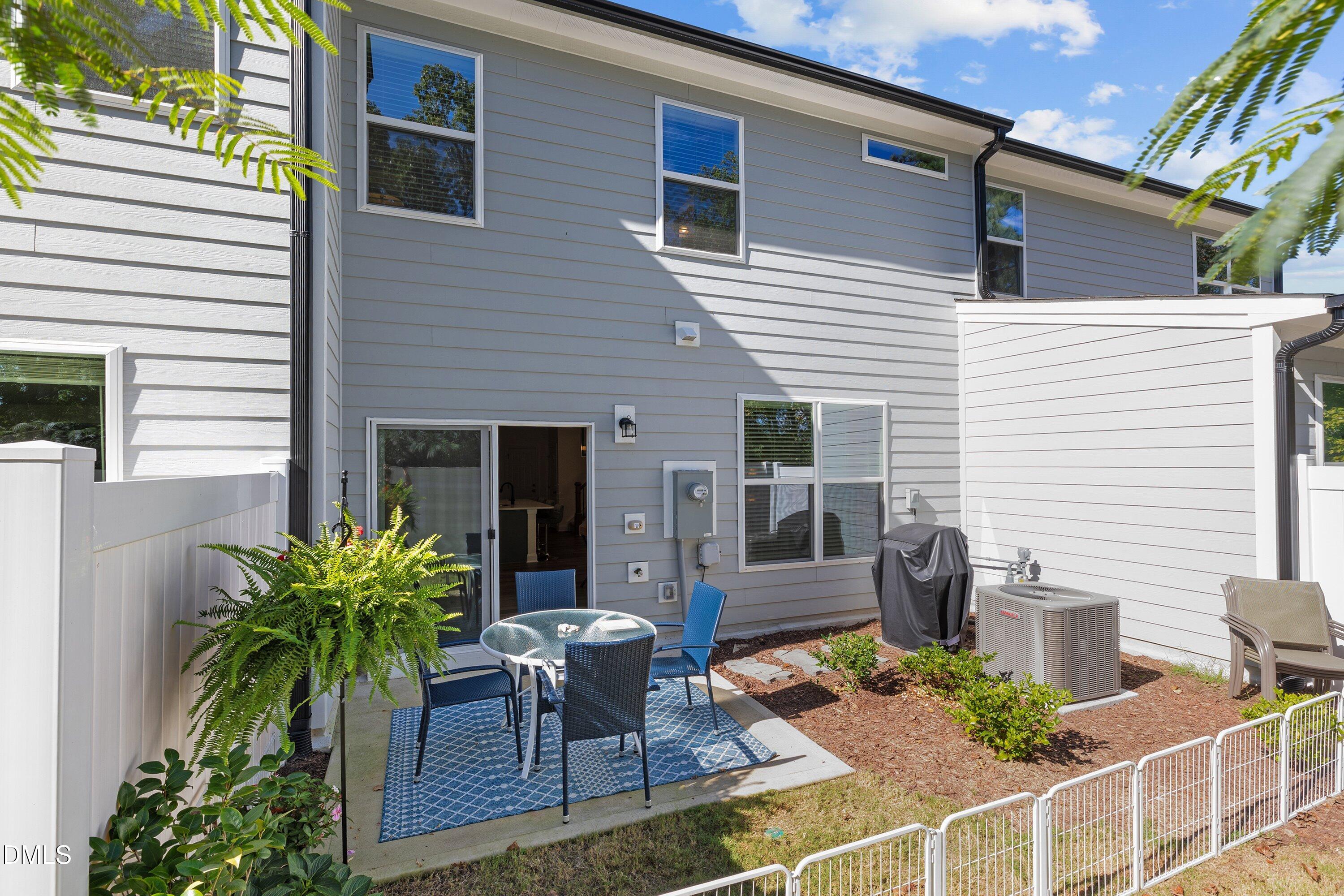 1014 Culloden Circle Durham, NC 27713 - Photo 30 of 32 a view of backyard of house with outdoor seating and green space
