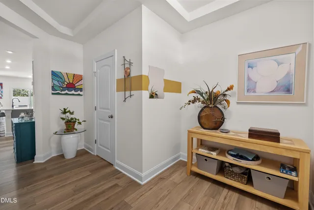 a view of kitchen with wooden floor and electronic appliances