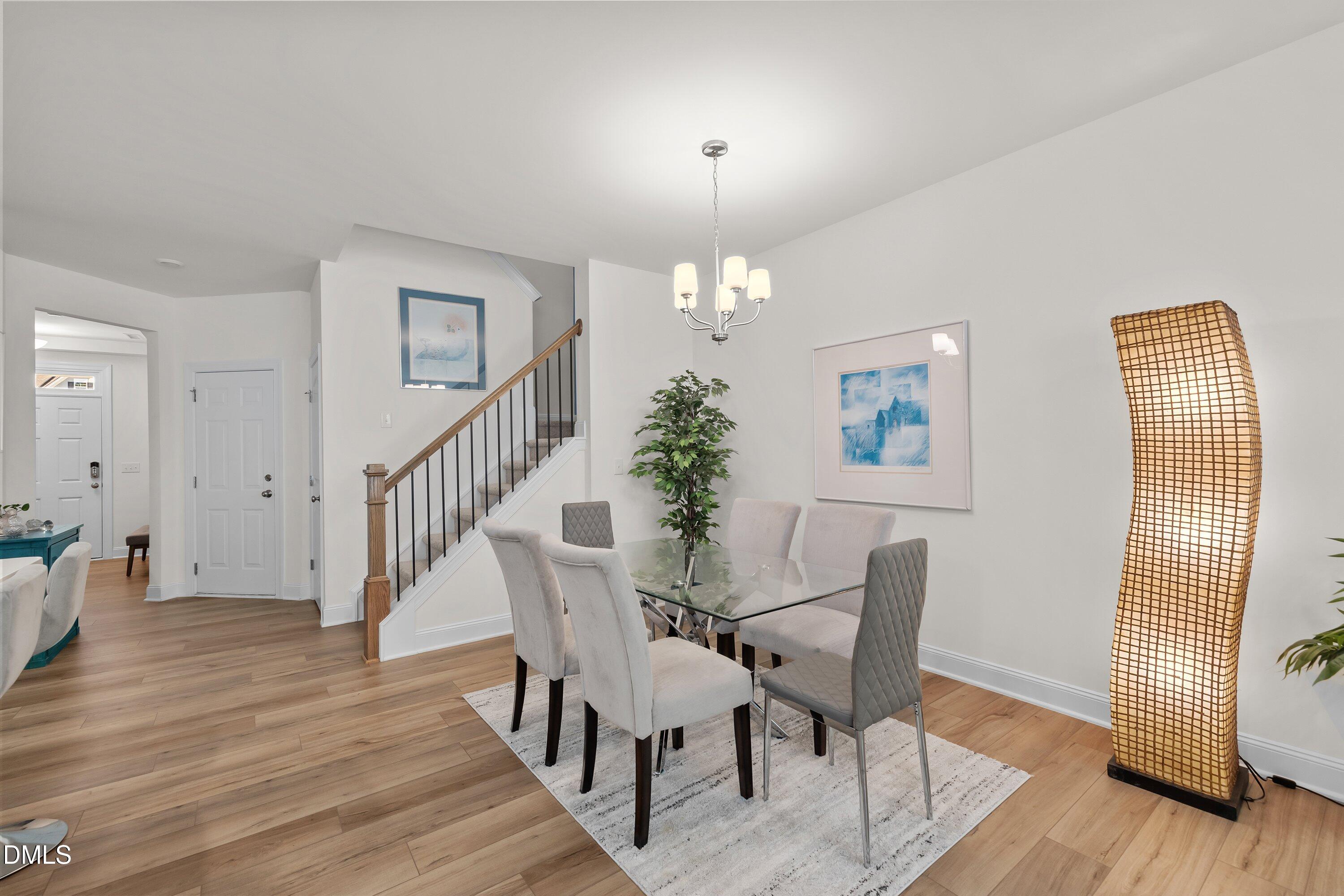 1014 Culloden Circle Durham, NC 27713 - Photo 5 of 32 a view of a dining room with furniture and wooden floor