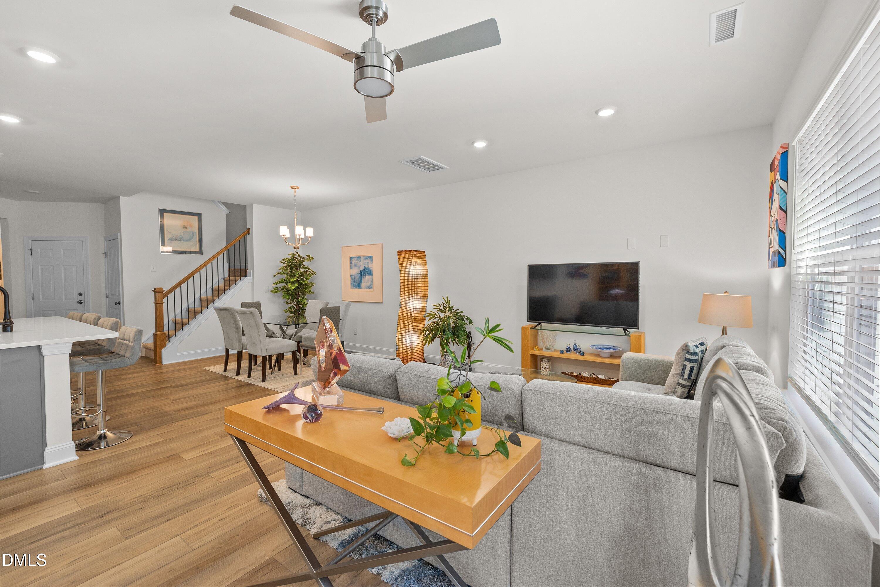 1014 Culloden Circle Durham, NC 27713 - Photo 8 of 32 a living room with furniture and a flat screen tv
