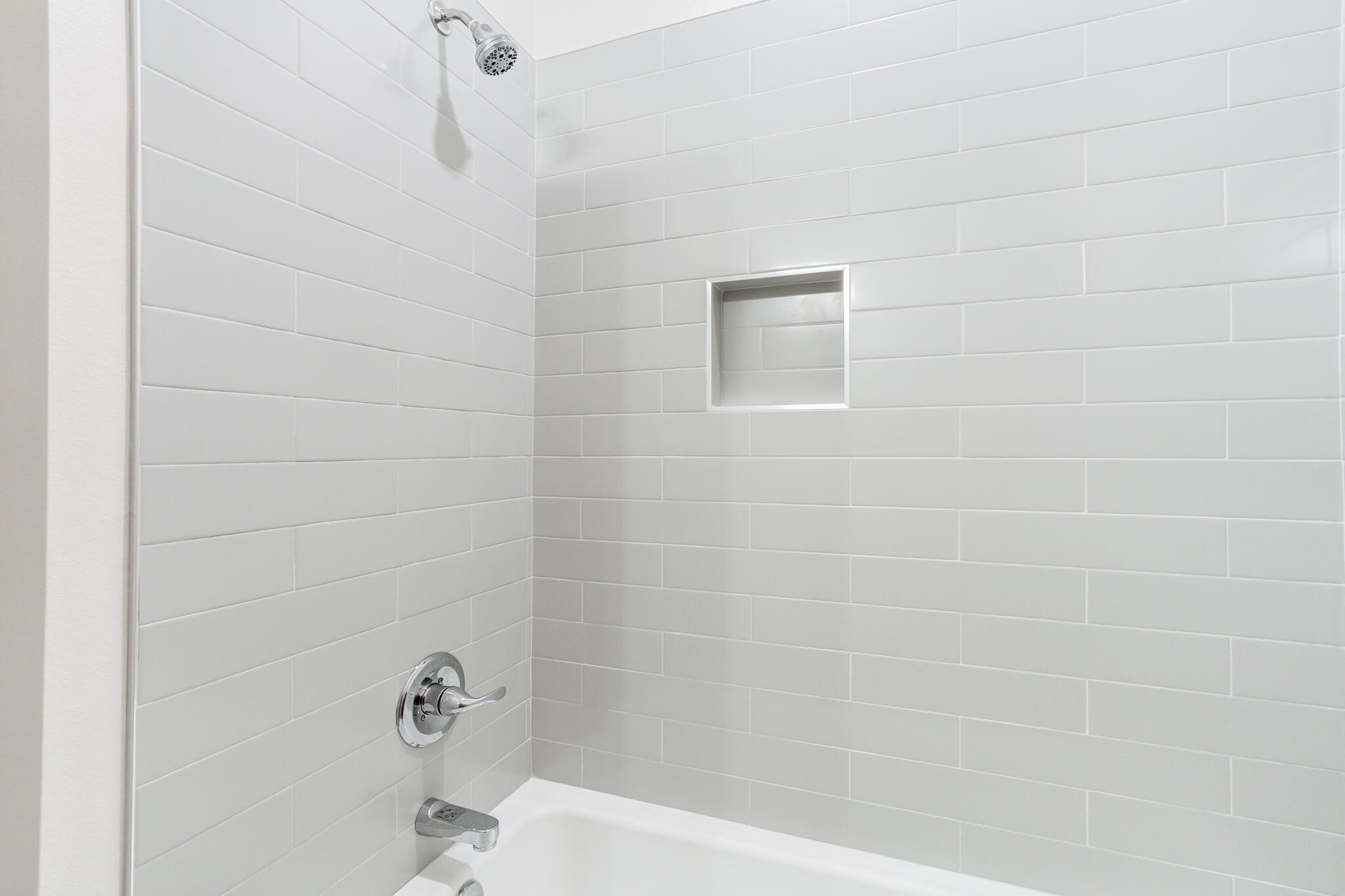 7046 41st Street Lubbock, TX 79407 - Photo 18 of 28 a bathroom with a shower