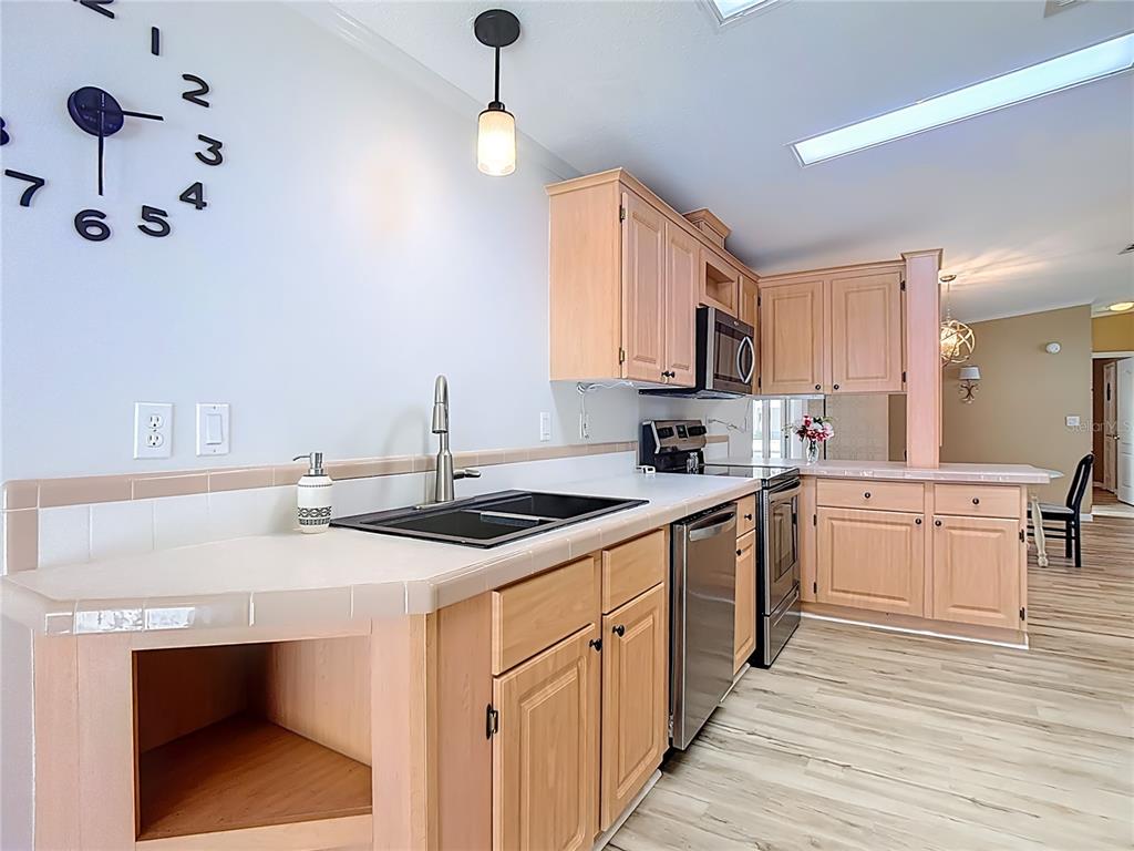452 Par Drive Frostproof, FL 33843 - Photo 16 of 41 a kitchen with a sink cabinets and wooden floor
