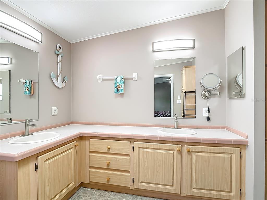 452 Par Drive Frostproof, FL 33843 - Photo 23 of 41 a bathroom with a sink and a mirror