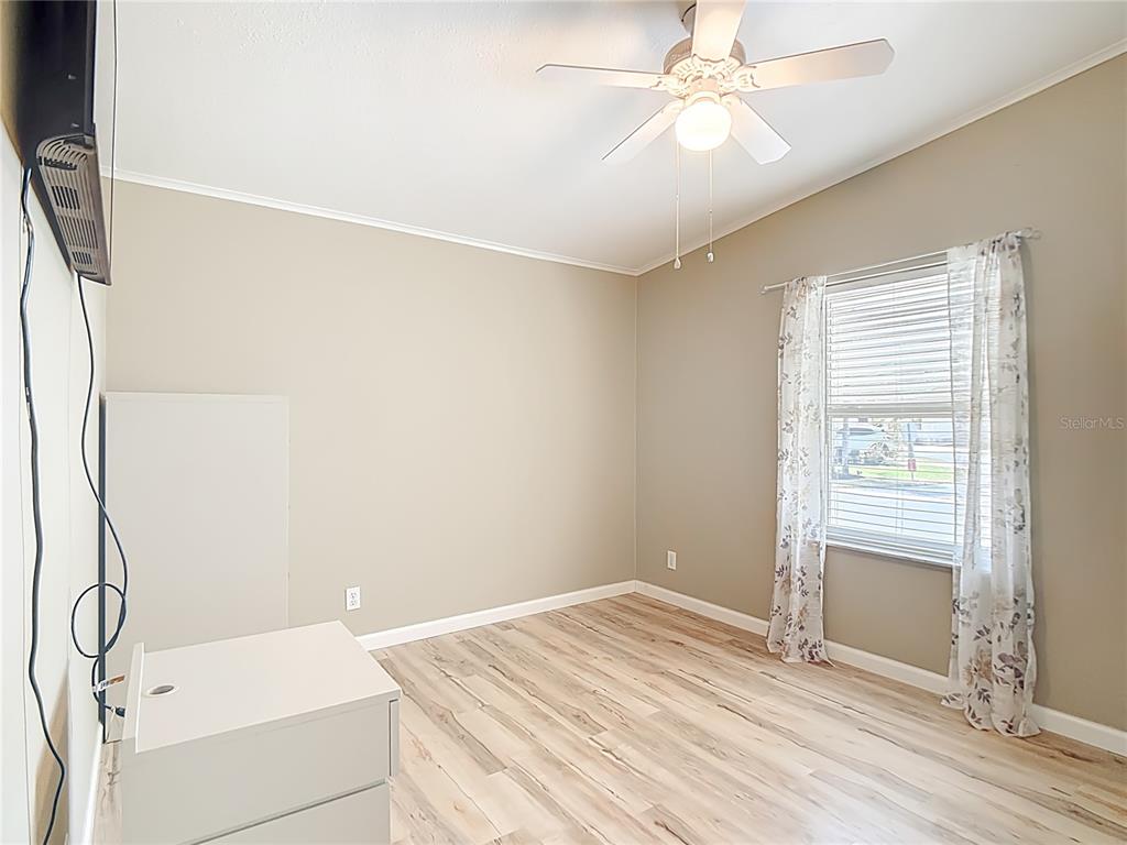 452 Par Drive Frostproof, FL 33843 - Photo 26 of 41 a room with a window and a ceiling fan