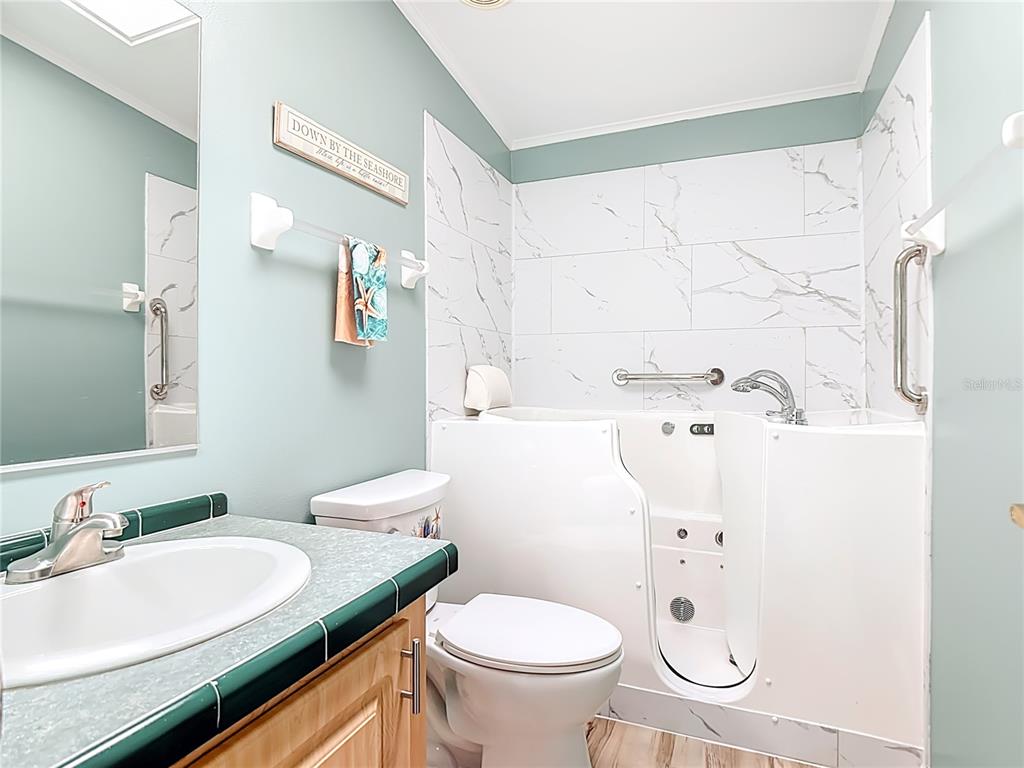 452 Par Drive Frostproof, FL 33843 - Photo 33 of 41 a bathroom with a sink toilet and mirror