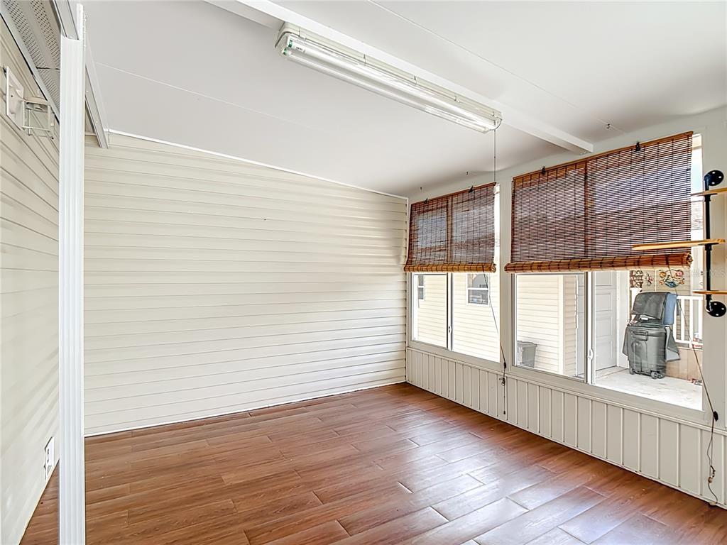 452 Par Drive Frostproof, FL 33843 - Photo 5 of 41 a view of an empty room with wooden floor and a window