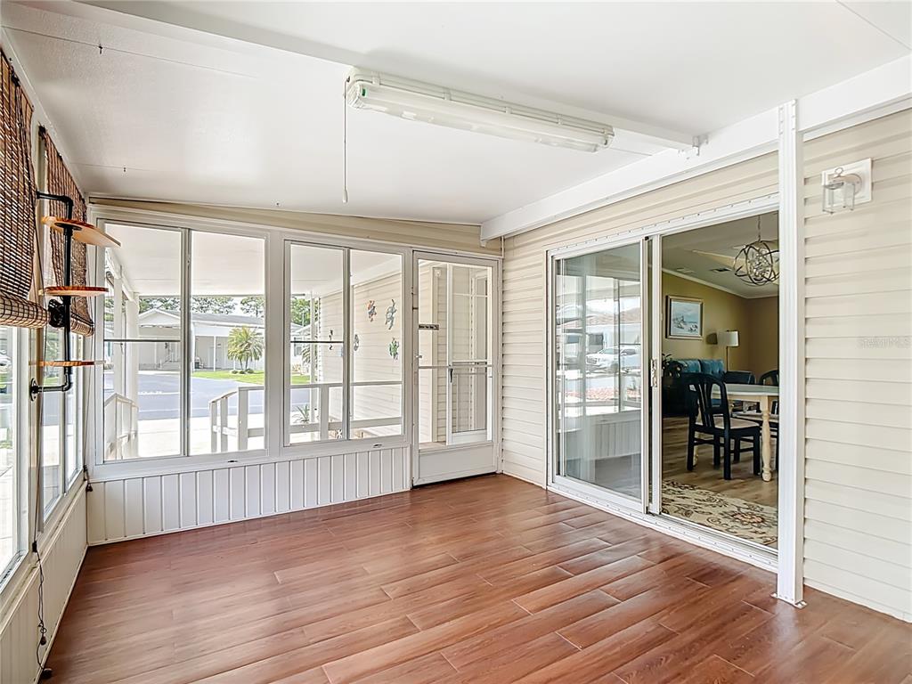 452 Par Drive Frostproof, FL 33843 - Photo 6 of 41 an empty room with wooden floor and windows