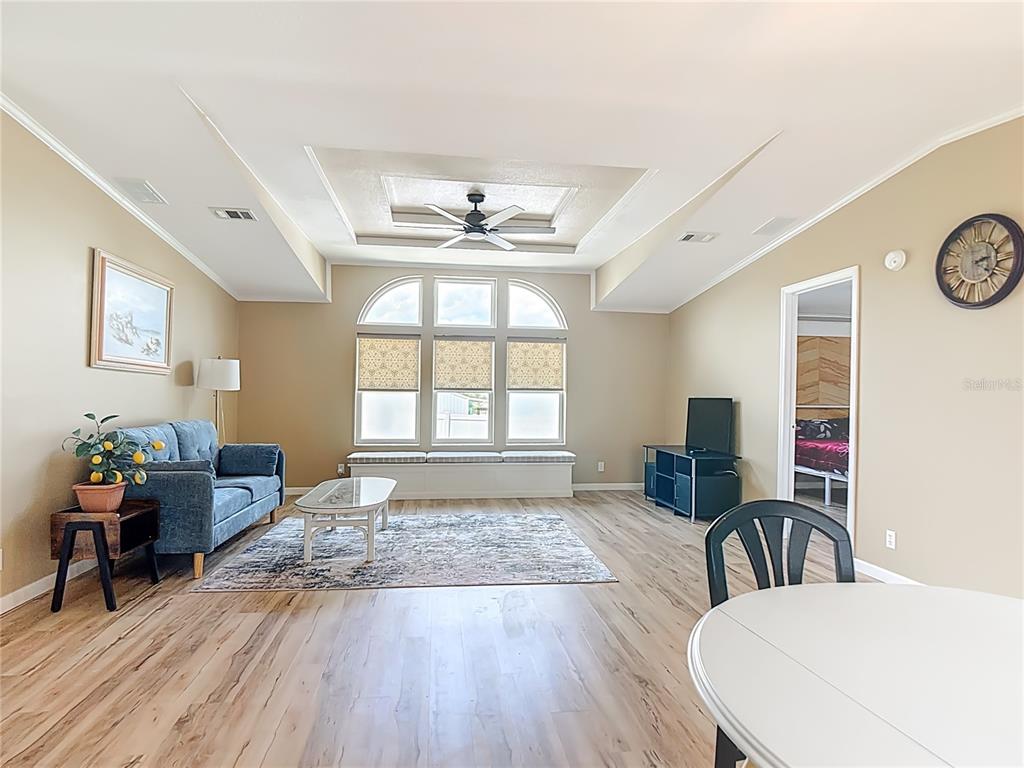 452 Par Drive Frostproof, FL 33843 - Photo 7 of 41 a view of a livingroom with furniture window and wooden floor