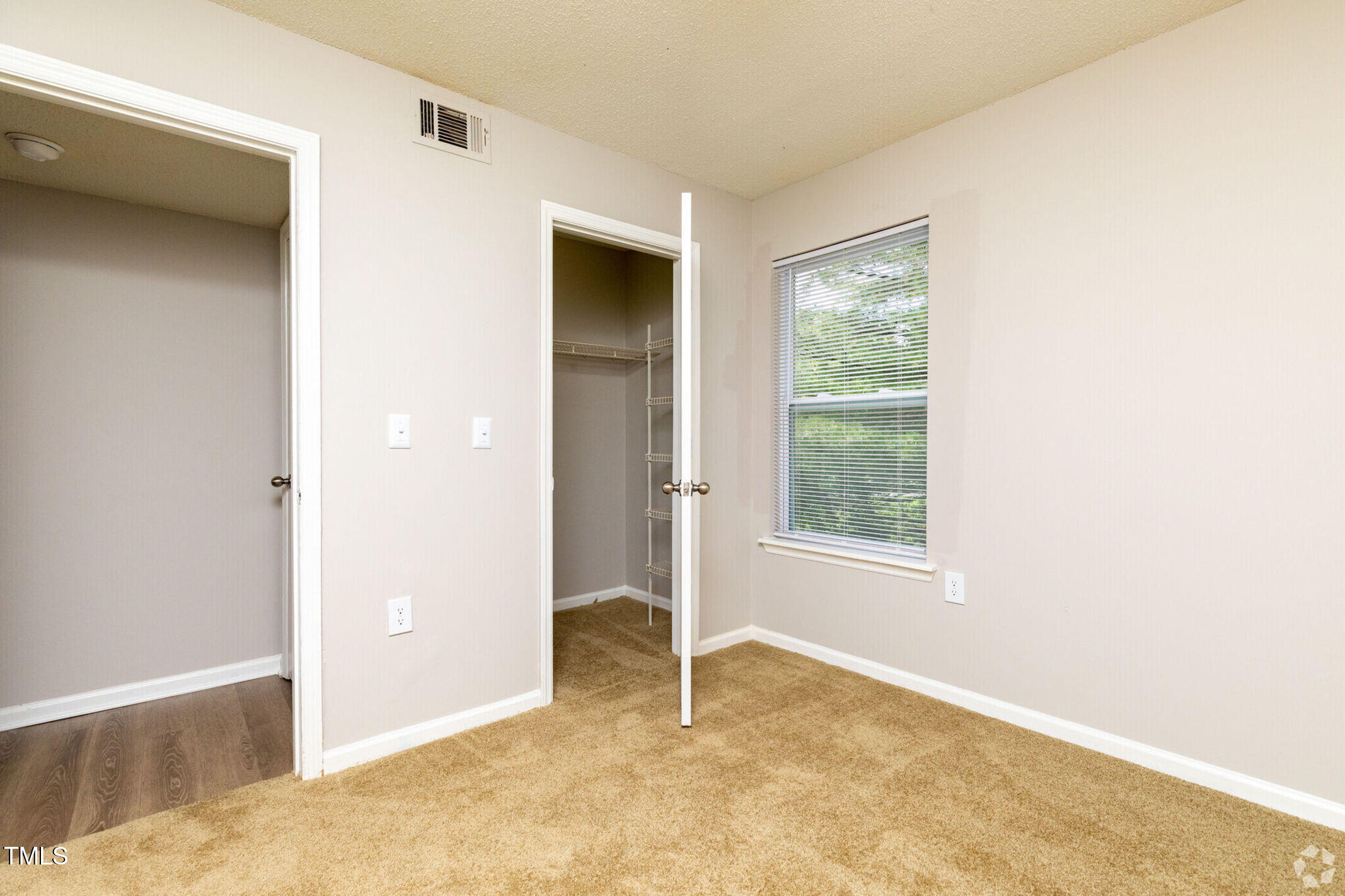 115 Holiday Park Road, Unit 3BED Hillsborough, NC 27278 - Photo 8 of 16 a view of an empty room with a window