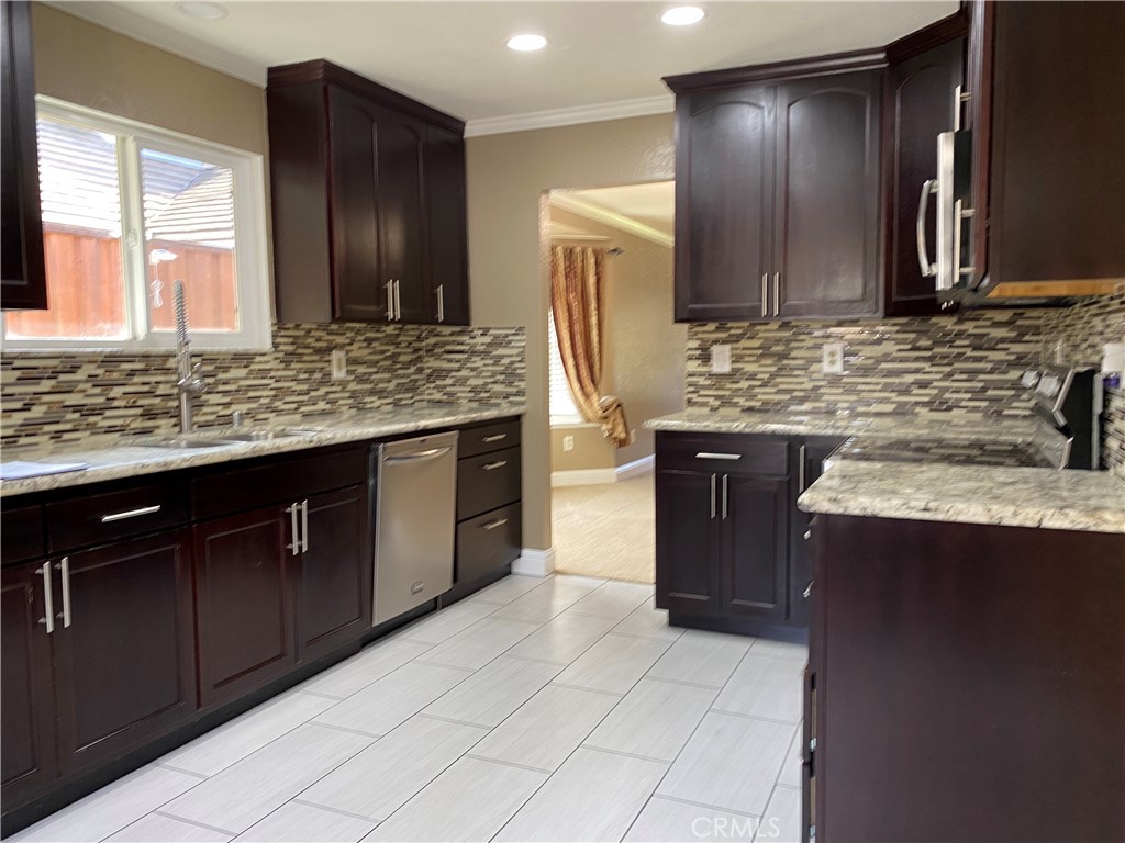 5409 Covert Road Salida, CA 95368 - Photo 11 of 23 a kitchen with a sink and a refrigerator