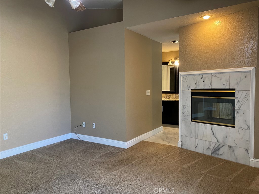 5409 Covert Road Salida, CA 95368 - Photo 13 of 23 a view of an empty room with a fireplace
