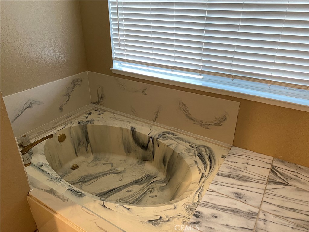 5409 Covert Road Salida, CA 95368 - Photo 15 of 23 a bathroom with a tub and a window