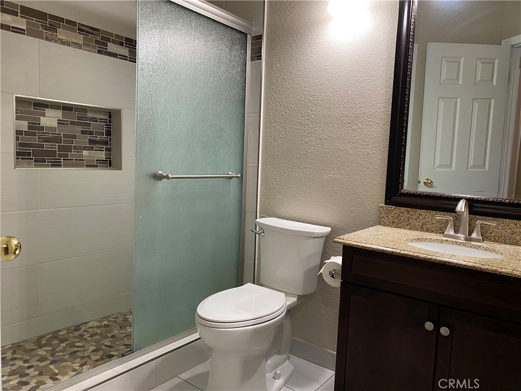 5409 Covert Road Salida, CA 95368 - Photo 18 of 23 a bathroom with a sink a toilet and shower