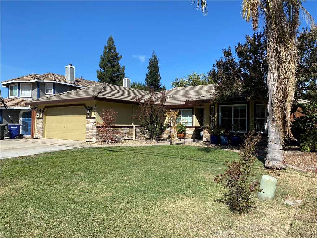 5409 Covert Road Salida, CA 95368 - Photo 2 of 23 a front view of a house with a garden