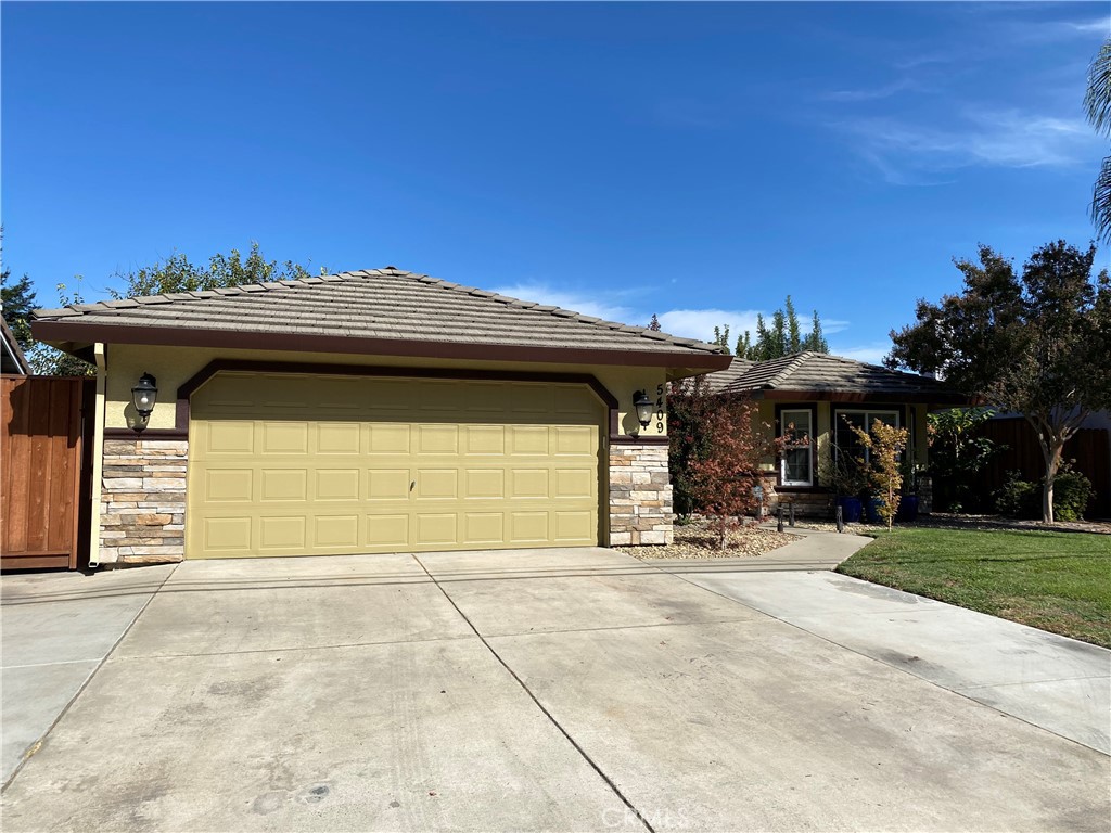 5409 Covert Road Salida, CA 95368 - Photo 3 of 23 a front view of a house with a garage