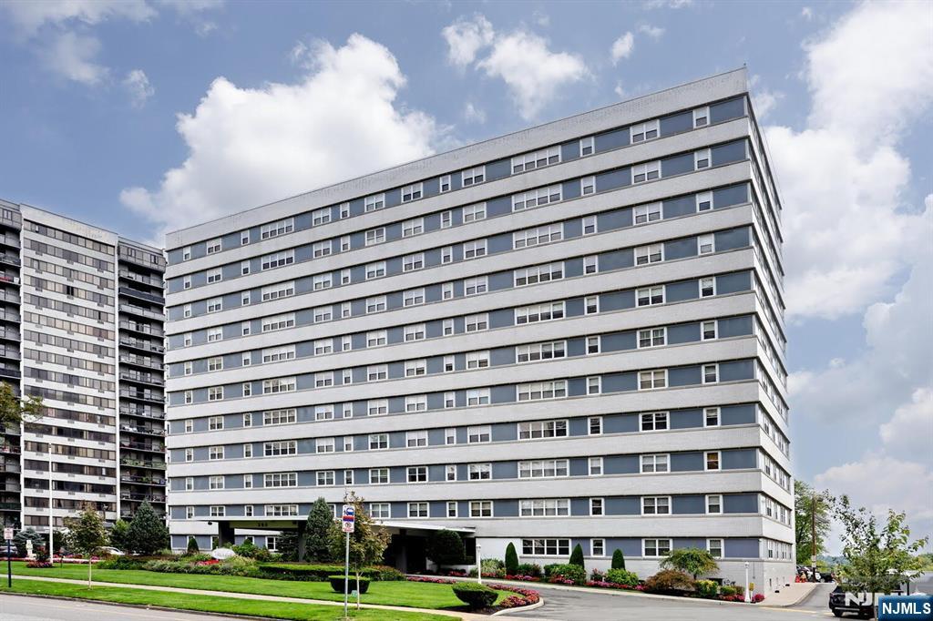 a view of a building with a yard