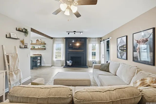 a living room with furniture and a fireplace