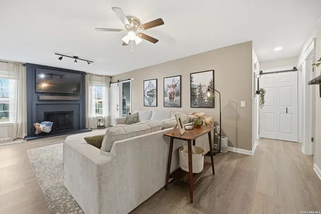 a living room with furniture and a fireplace