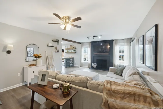 a living room with furniture and a large window