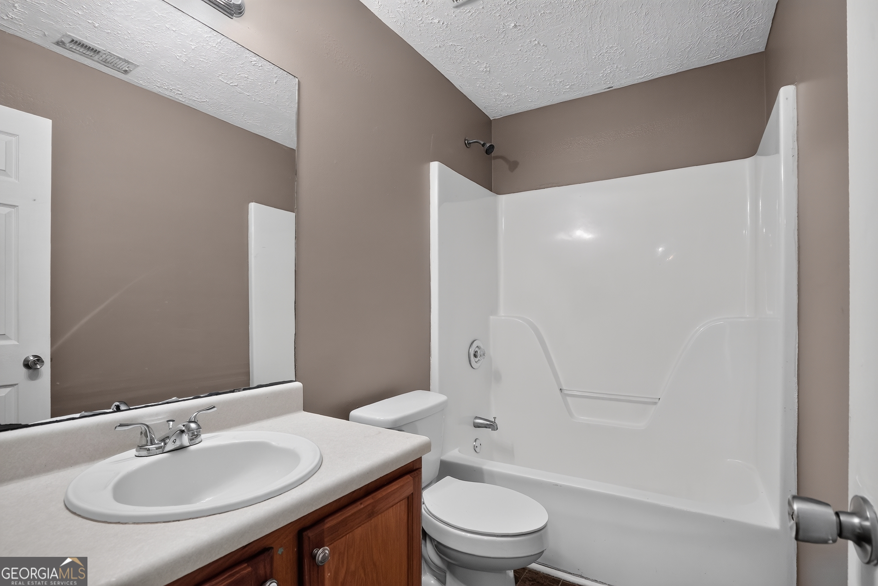75 Linsley Way Covington, GA 30016 - Photo 35 of 48 a bathroom with a sink a toilet and shower