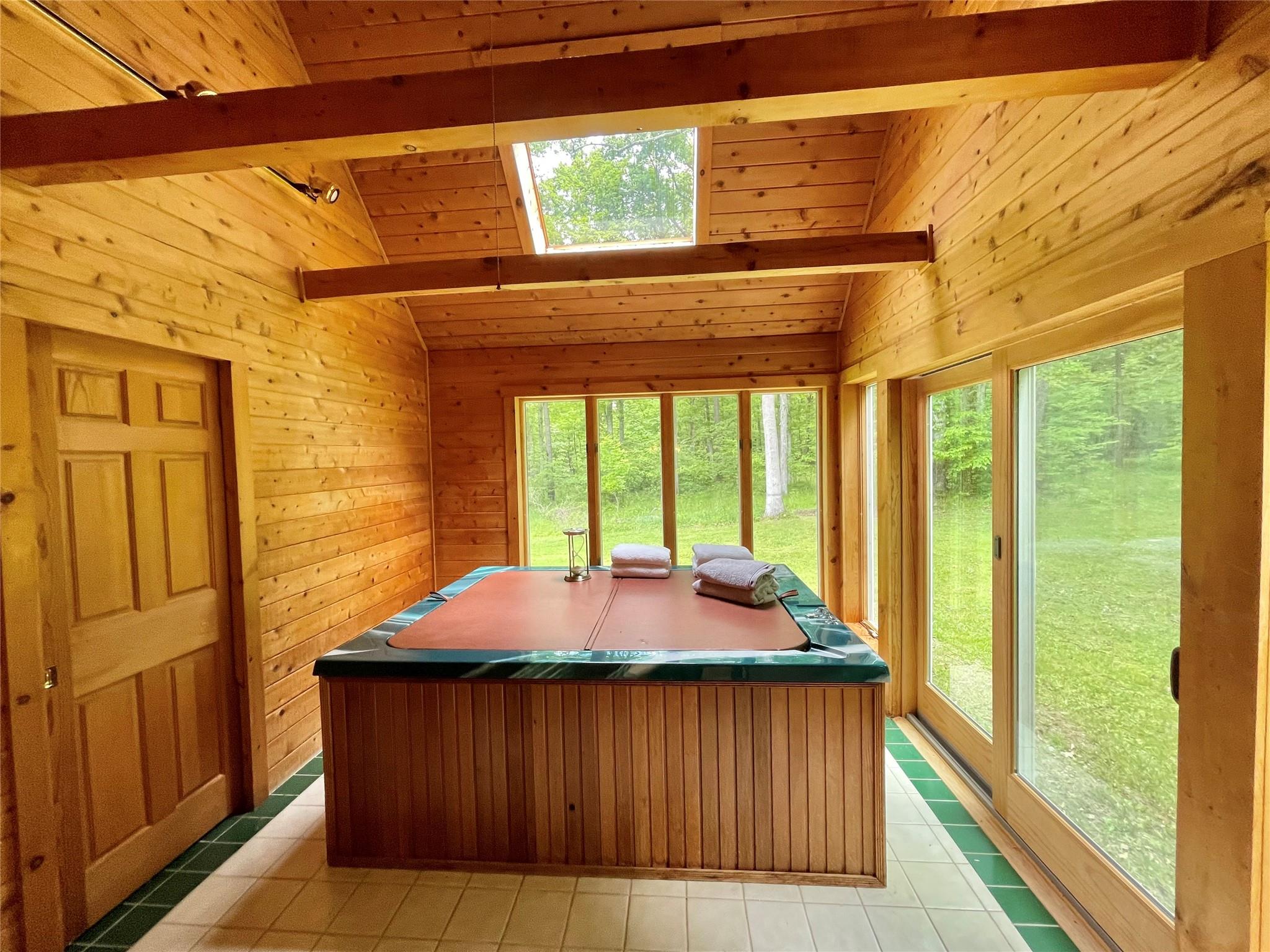 71 Saddleback Ridge Wallkill, NY 12589 - Photo 12 of 39 Cedar Sunroom / solarium with hot tub healthy amount of natural light