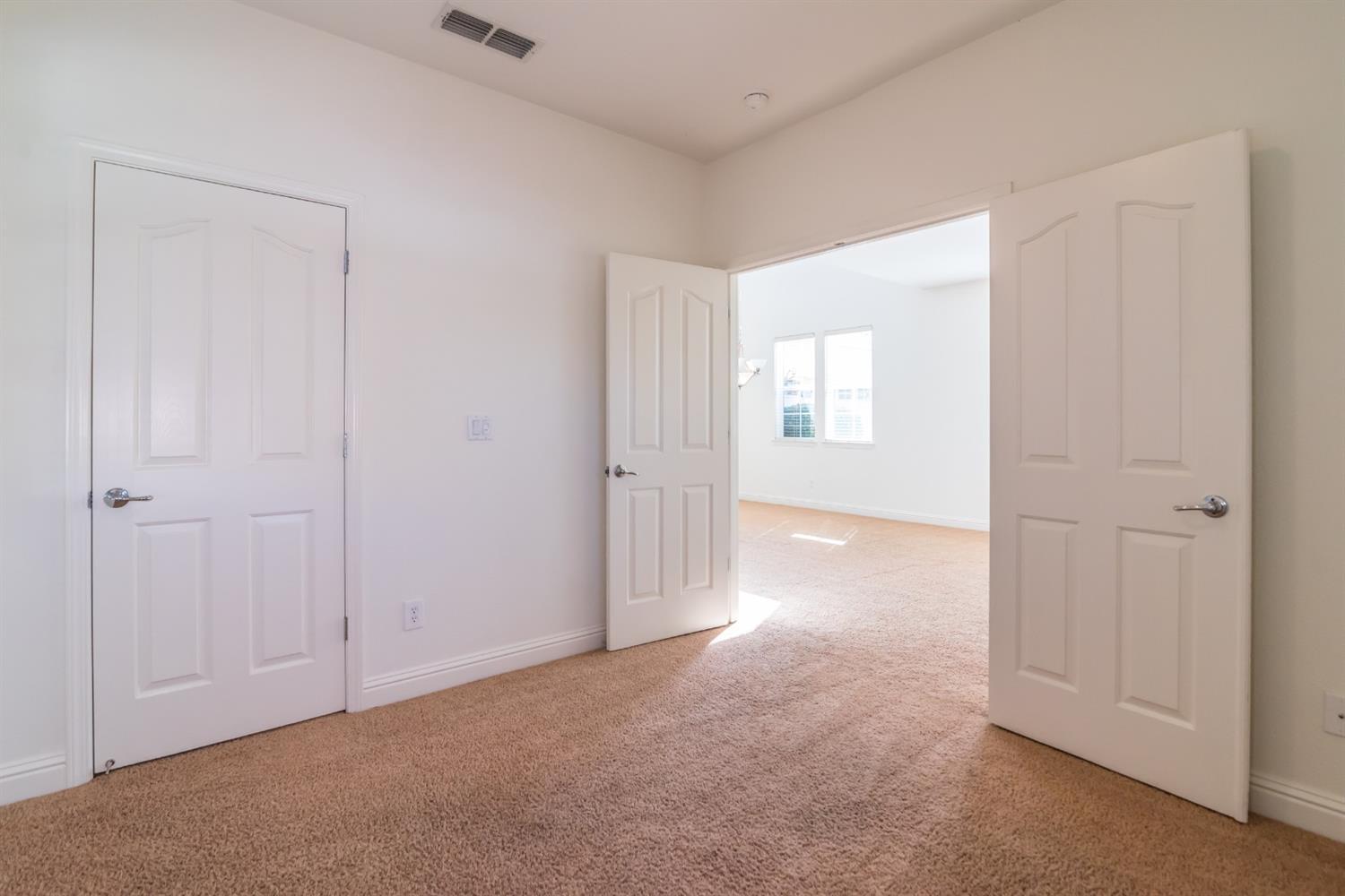 11737 Brook Valley Way Rancho Cordova, CA 95742 - Photo 13 of 25 a view of an empty room and window