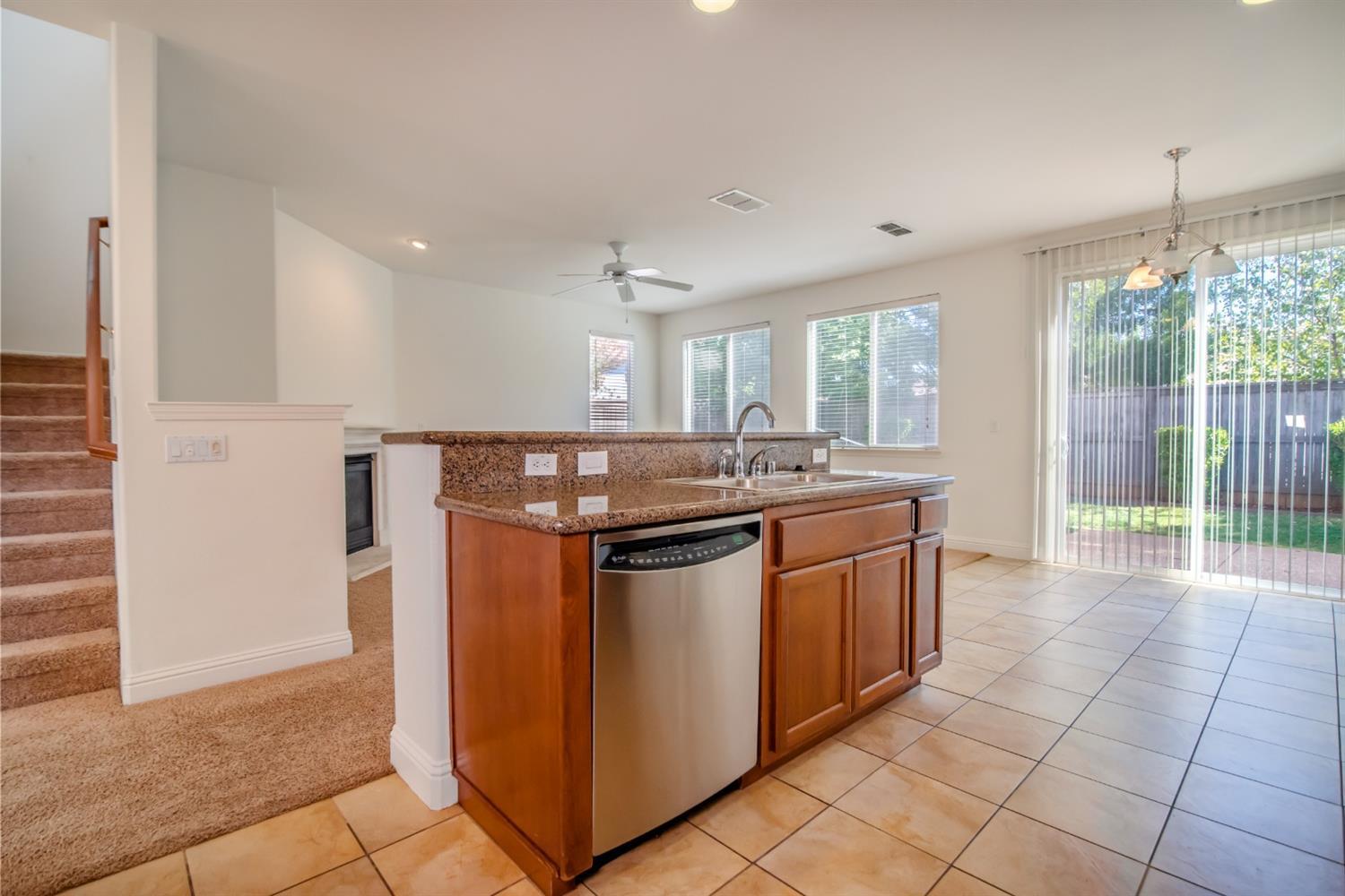11737 Brook Valley Way Rancho Cordova, CA 95742 - Photo 14 of 25 a kitchen with stainless steel appliances granite countertop a stove and a sink