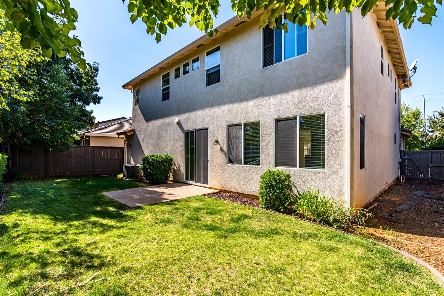 11737 Brook Valley Way Rancho Cordova, CA 95742 - Photo 18 of 25 a front view of a house with garden