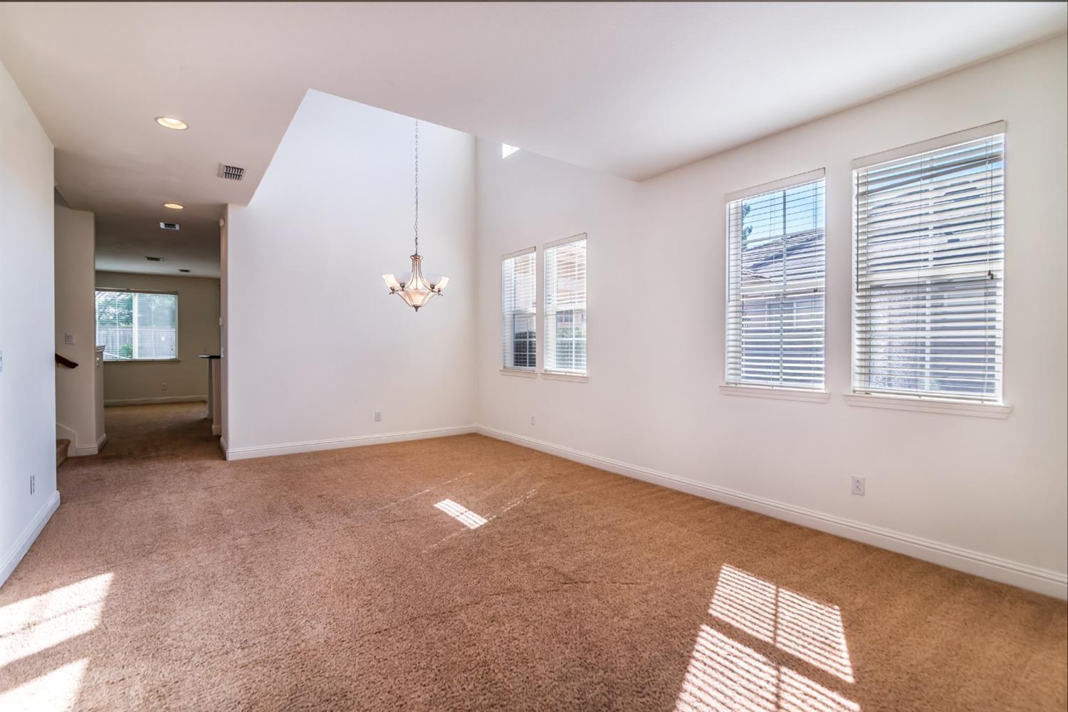 11737 Brook Valley Way Rancho Cordova, CA 95742 - Photo 4 of 25 an empty room with windows