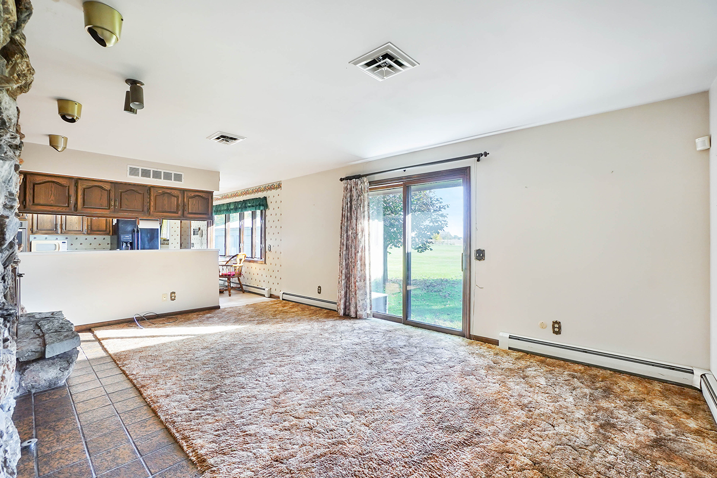 1850 Little Rock Road Plano, IL 60545 - Photo 12 of 30 a view of a livingroom with wooden floor and cabinet