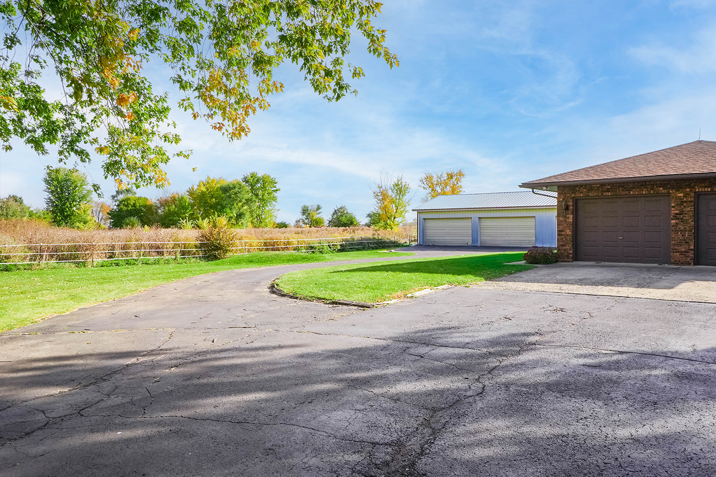 1850 Little Rock Road Plano, IL 60545 - Photo 23 of 30 a view of a house with a big yard and large trees
