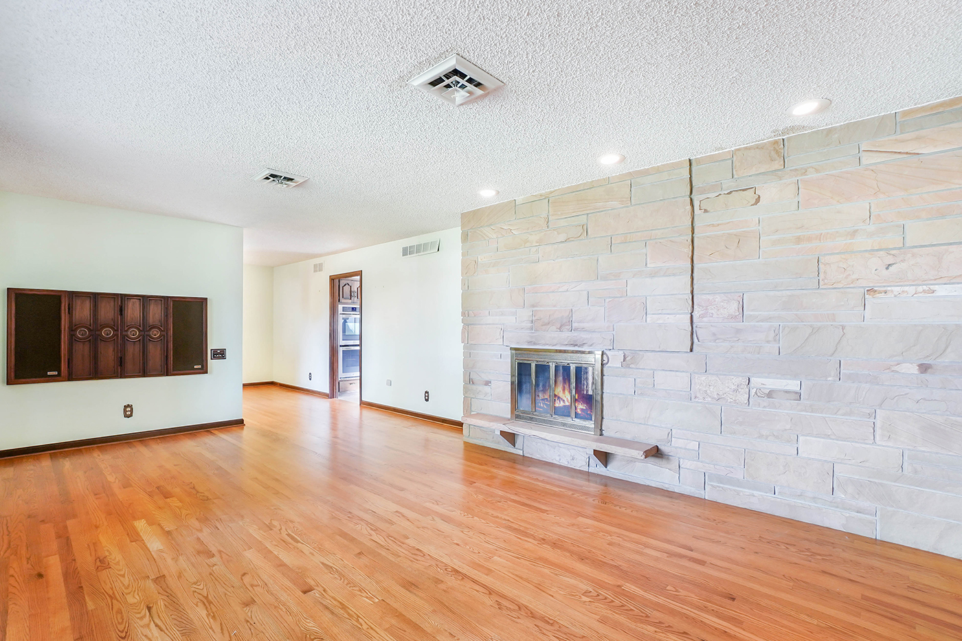 1850 Little Rock Road Plano, IL 60545 - Photo 4 of 30 a view of an empty room with wooden floor and a window