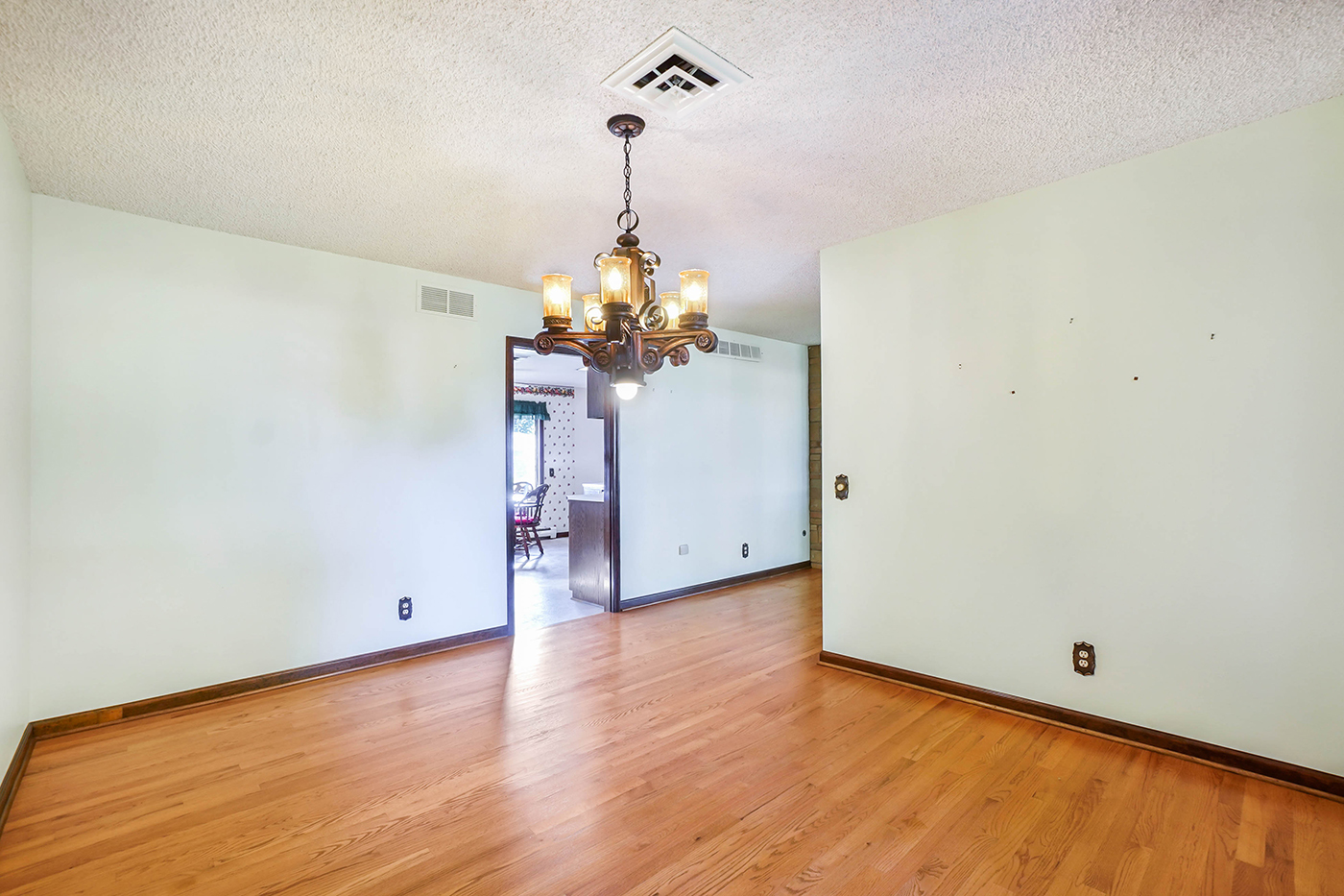 1850 Little Rock Road Plano, IL 60545 - Photo 6 of 30 a view of a chandelier fan and wooden floor