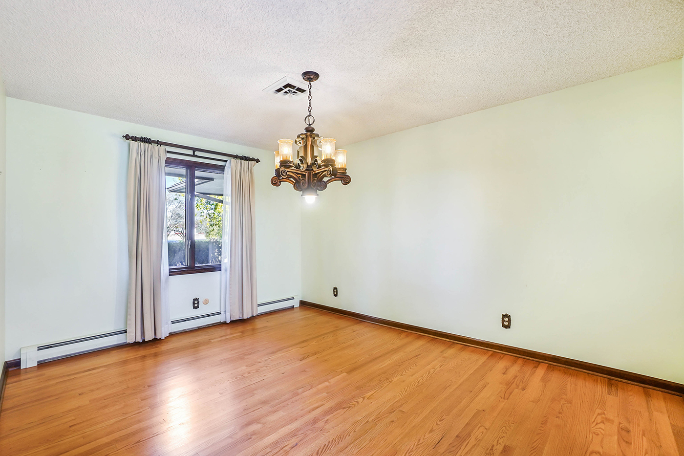1850 Little Rock Road Plano, IL 60545 - Photo 7 of 30 a view of a room with wooden floor and chandelier