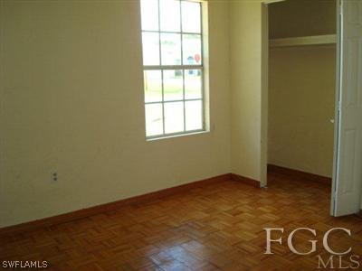 4204 9th Street Southwest Lehigh Acres, FL 33976 - Photo 3 of 10 an empty room with windows
