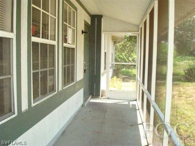 4204 9th Street Southwest Lehigh Acres, FL 33976 - Photo 5 of 10 a view of an front door