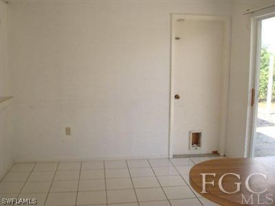 4204 9th Street Southwest Lehigh Acres, FL 33976 - Photo 8 of 10 a view of an empty room with a window
