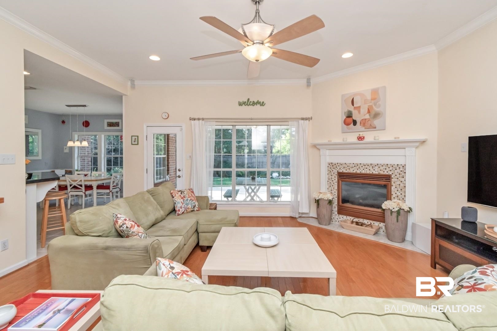 8520 Gayla Court Mobile, AL 36695 - Photo 6 of 40 Living area featuring wood-finish flooring and a ceiling fan with integrated lighting